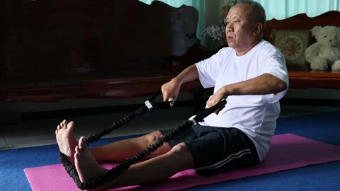 Asian senior man Doing exercise at home Video stock 251152648