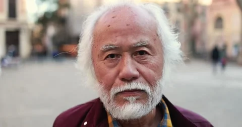 Asian senior man looking at camera outdoor Stock Footage 174240887