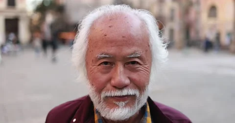 Asian senior man smiling on camera outdoor Stock Footage 174240631