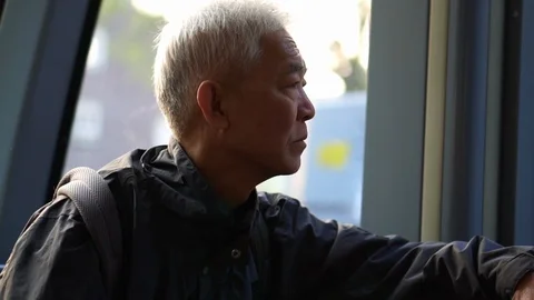 Asian senior man using public transportation Stock Footage 105167592