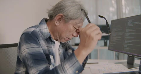 Asian Senior Programmer Experiencing Fatigue After Long Coding Session. Stock Footage 308162433