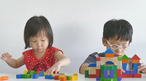 Asian siblings playing blocks Stock Footage 56356546