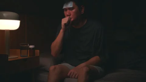 Asian sick man coughing while sleeping at night in the bedroom. Stock Footage 266894461