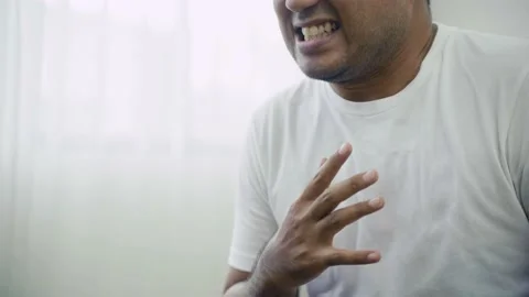 Asian sick person has  pain in chest , He has difficulty breathing or pain in ch Stock-Footage 135295341
