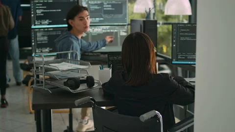 Asian software developer with impairment writing code with html script in data Stock Footage 220379925