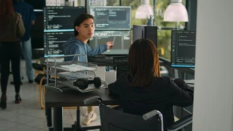 Asian software developer with impairment writing code with html script in data Stockfoto's