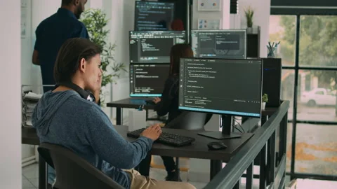 Asian software engineer working on security program with server code Stock Footage 217408083