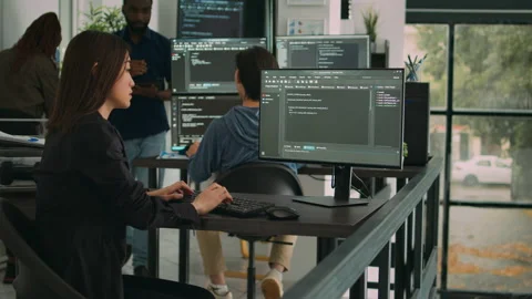 Asian software engineer working with user interface on computer screen Stock Footage 217409360