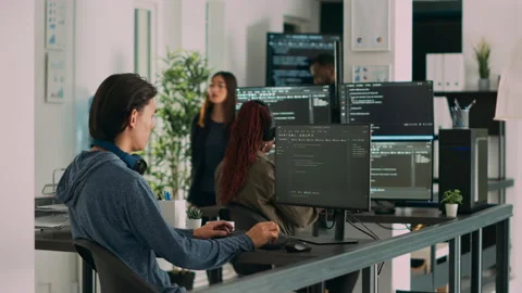 Asian software programer writing code on computer Stock Footage 227616757