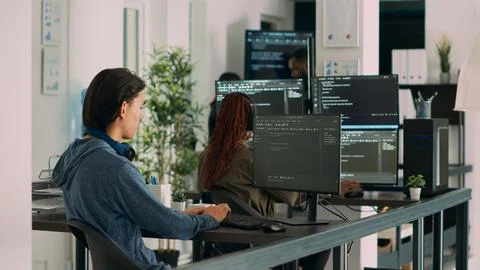 Asian software programer writing code on computer 스톡 사진