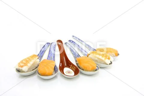 Asian soup spoons with sushi - one is empty Stock Photos