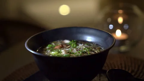 Asian soup in the sunshine on a table Stock Footage 273381991