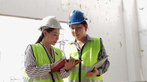 Asian structural and systems engineer at the construction site Stock Footage 201666205