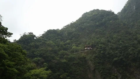 Asian Structure Built Into Mountainside Wide Shot Video stock 101931770