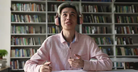Asian student guy studying distantly using videocall app Stock Footage 225516171