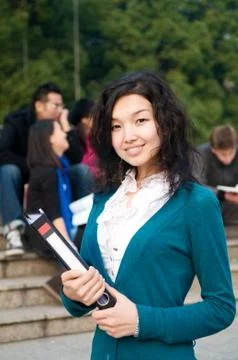 Asian student with notepad Stock Photos