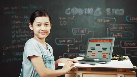 Asian student programing engineering code with equipment on table. Edification. Foto stock
