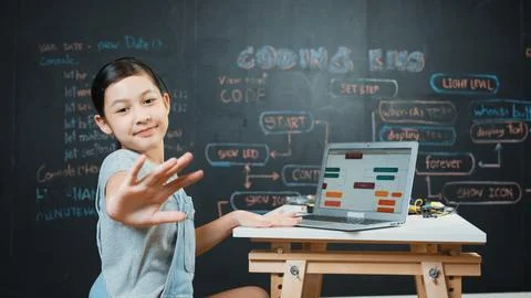 Asian student programing engineering code with equipment on table. Edification. Stock Photos