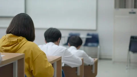 Asian student taking an exam Video stock 88124264