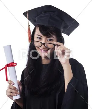 Asian student wearing graduation gown Stock Photos
