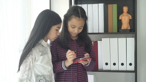 Asian students boy using laptop learning in the classroom at school Stockbeeldmateriaal 105837735