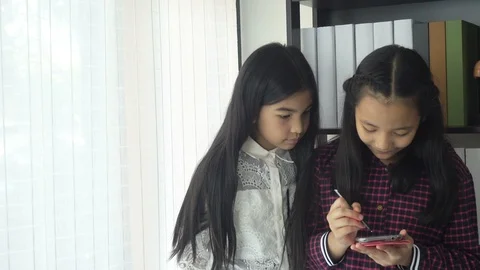 Asian students boy using laptop learning in the classroom at school Stockbeeldmateriaal 105837790