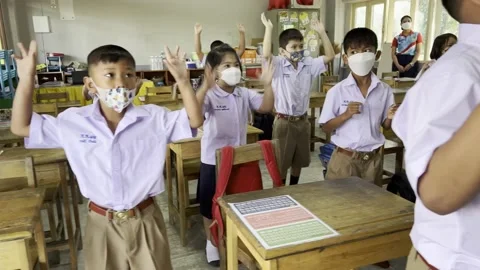 Asian students dancing in the classroom Stock Footage 192547397