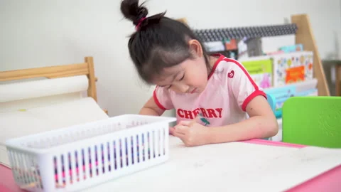 Asian students doing homework at home Stock Footage 131509174