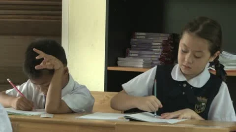 Asian Students Doing School Work In A Classroom 스톡 동영상 12436893