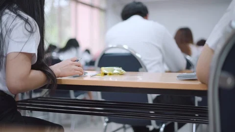 Asian students taking an exam Stock Footage 90410764