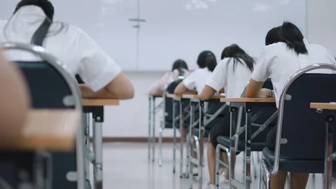 Asian students taking an exam Video stock 90411834