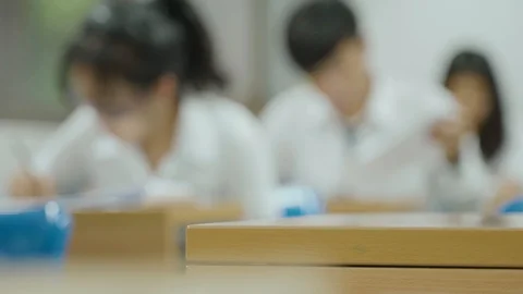 Asian students taking an exam Stock Footage 97255837