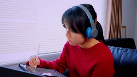 Asian students work from home on tablet devices to do information research, make Stock Footage 146457787