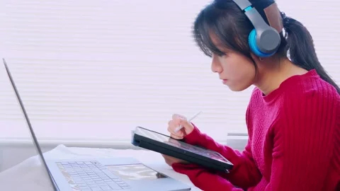 Asian students working from home Through tablet devices during the COVID-19 situ Stock Footage 146170823