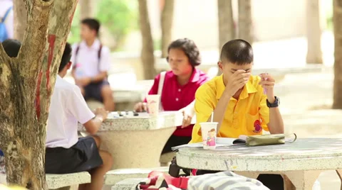 Asian Students Working On School Work During Lunch Break 스톡 동영상 34547212