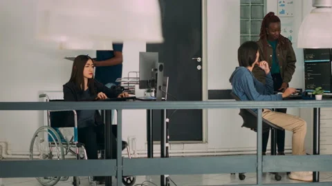 Asian system engineer with impairment programming app script on terminal window Video stock 222022441