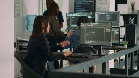 Asian system engineer trying to find html script and code to program cloud Stock Footage 217408305