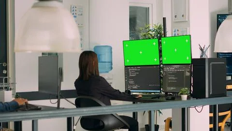 Asian system engineer using html script code and greenscreen on multiple Stock Photos