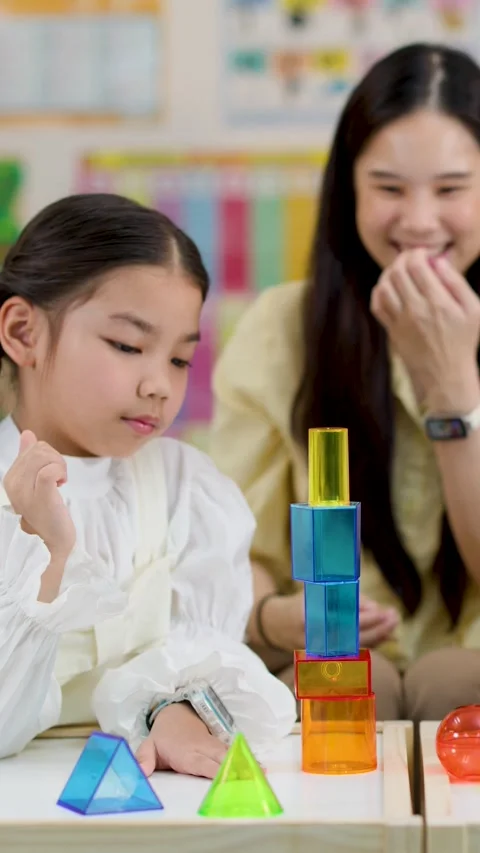 Asian Teacher and Primary Students Learning Geometry with 3D Shapes Stock Footage 330102371