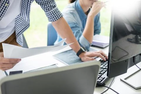 Asian team Outsource Developer Looking Screen Programming Code Working with L Stock Photos