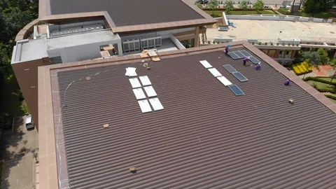 Asian technician installing new solar panel Stock Footage 90927863