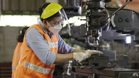 Asian technician or engineer working on machine in industrial plant. Stock-Footage 154366498