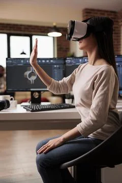 Asian technician with vr glasses developing product Stock Photos