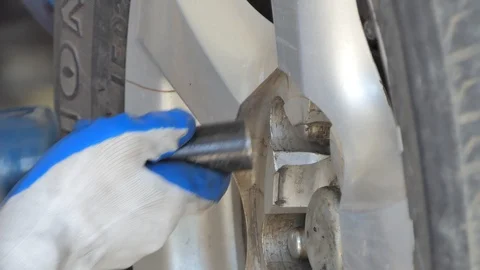 Asian technicians are changing tire in garage. Stock Footage 121266090