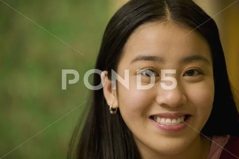 Asian teenage girl smiling Stock Photos
