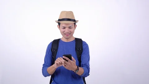 Asian Thai tourist using smart phone for shopping on line on white background Stock Footage 119048984
