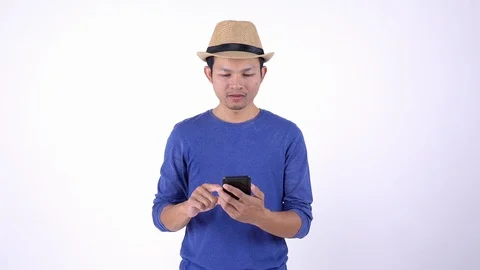 Asian Thai tourist using smart phone for shopping on line on white background Stock Footage 119676129