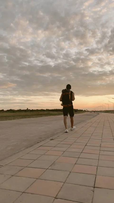 Asian tourist backpacker man walk along the river. Stock Footage 294761753