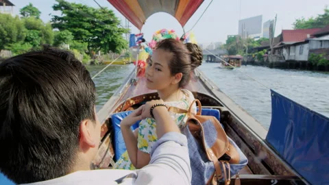 Asian tourist couple having an intimate real romantic love moment on tour longta Stock Footage