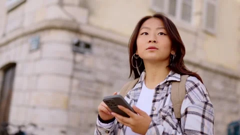 Asian tourist using gps application Stock Footage 287433694